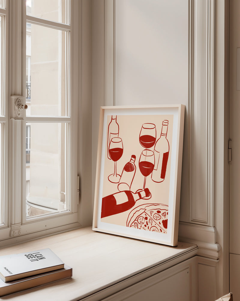 Framed artwork of red wine bottles and glasses on a windowsill.