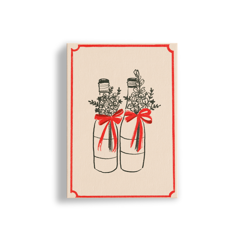 Framed artwork of two bottles with red bows and floral arrangements on a beige background