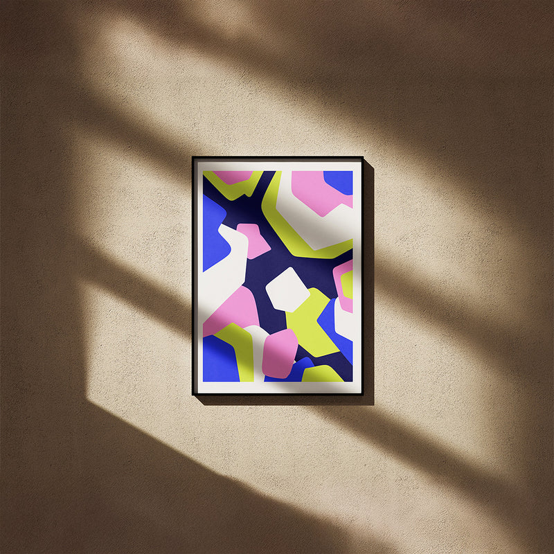 Framed abstract art print with colorful geometric shapes on a white background
