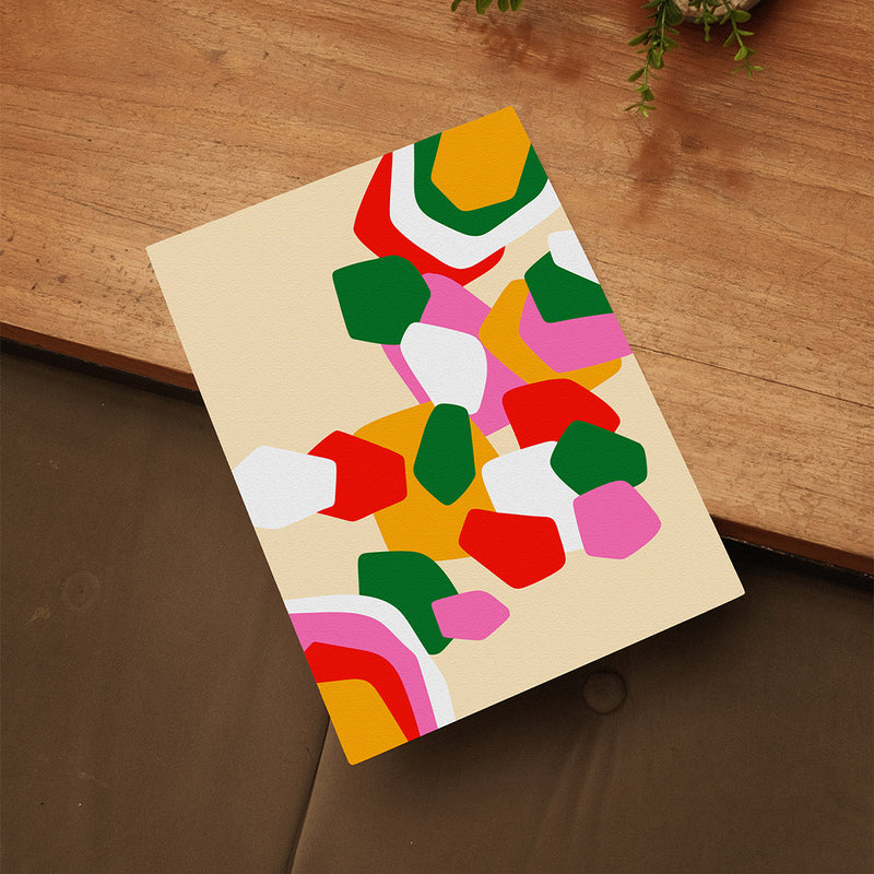 Framed abstract art print with colorful geometric shapes on a beige background